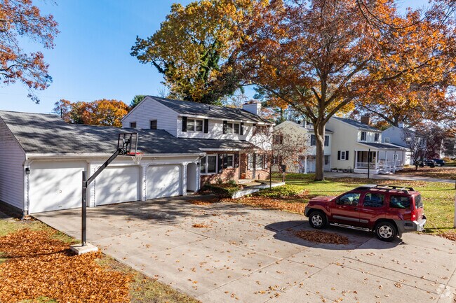 Homes of North Muskegon often have mature trees offering shade.