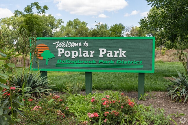 Poplar Park sign of Bolingbrook Park District with beautiful flowers and walking paths.