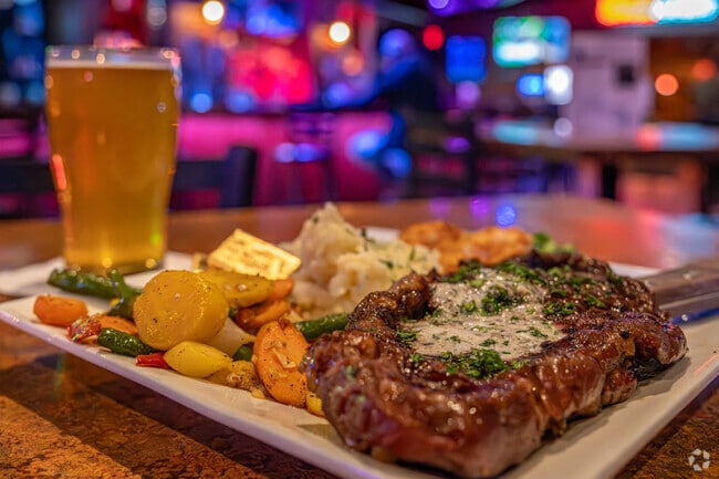 The Phoenix Grill & Event Center serves a ribeye steak and Spotted Cow near Eau Galle.