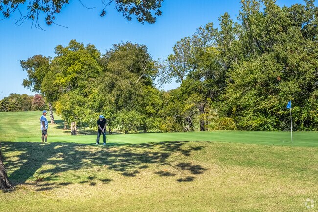 Frolich Meadows Estates locals enjoy time on the green in Trosper Golf Club.