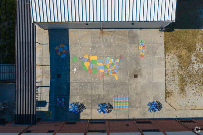 Colorful murals and charts are displayed on the blacktop at the Beaver Ridge Elementary School.