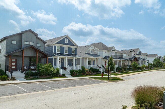 Bungalow-style homes with minimal landscaping are located in the Warrenville city center.