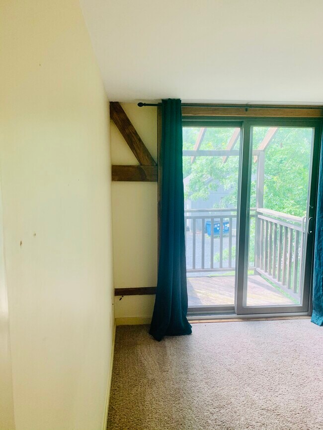 View in primary bedroom with balcony access