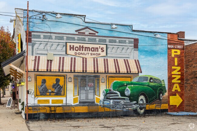 Colorful wall art decorates the side of Holtman’s Donuts in downtown Williamsburg.
