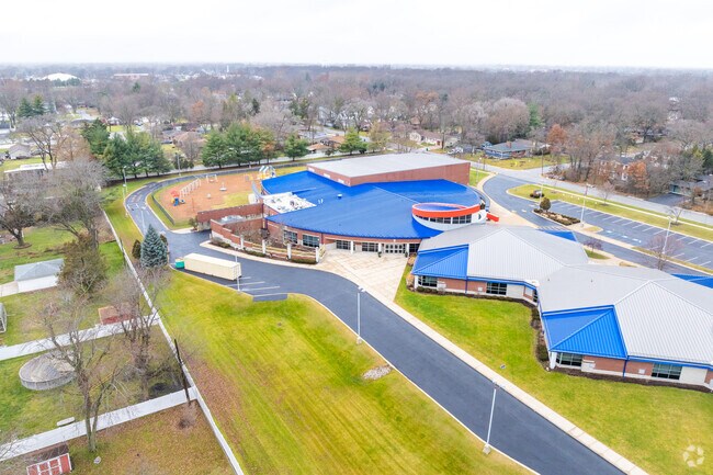 Ernest R Elliot Elementary School features a driveway around the entire building.