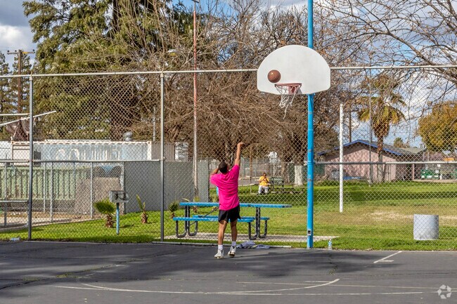 Play some basketball on the courts of Calwa Park in Fresno.