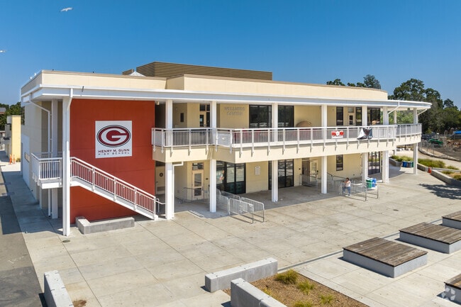 Henry Gunn High has a red accent wall that stands out against it's yellow building.