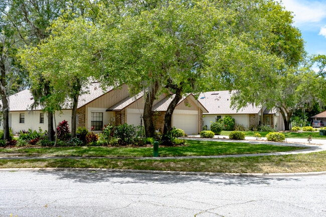 This South Port Orange home enjoys ample shade from the many mature trees.