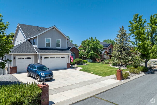 Craftsman and Colonial-style homes line this quiet street in Riverview, showcasing charm, symmetry, and curb appeal.