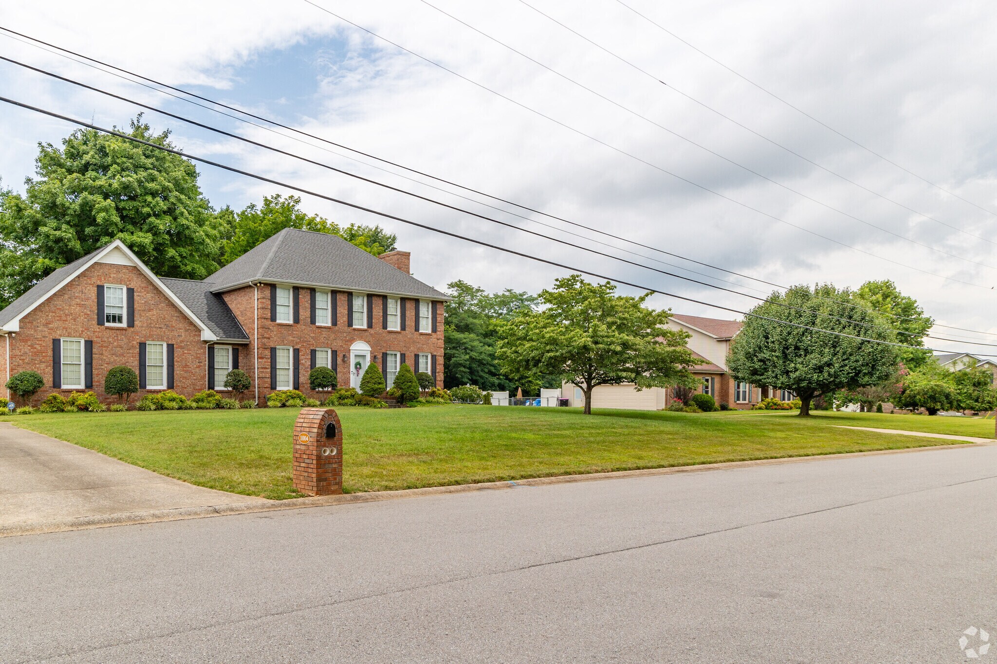 Page Estates features homes with green grassy lots.