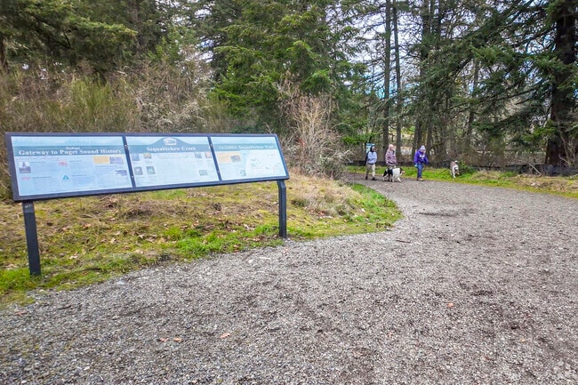 A local DuPont family walks there dogs in Sequalitchew Creek Trail.