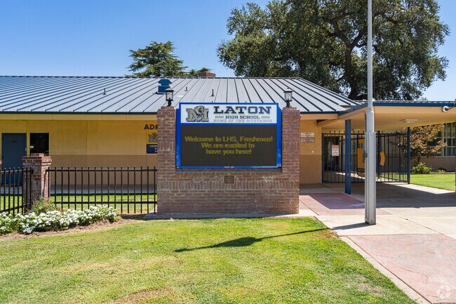 A lighted marquee at the entrance to Laton High School informs parents of events.