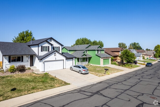 Colorful contemporary craftsman homes with three car garages in Broomfield, Colorado.