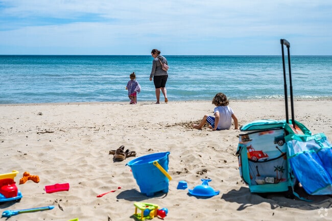 Families gather at one of two beaches in Port Washington, to enjoy the sun.