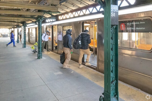 Residents of Kingsbridge take the 1 train downtown at the 238th Street station.