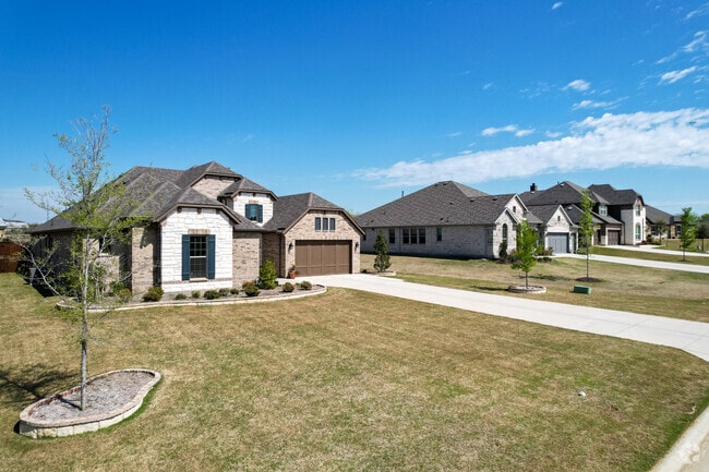 Luxurious homes in Hickory Creek with large yards for the children to play.