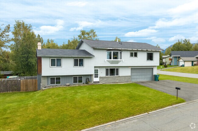A split level home with grass lawn are common in Northeast Anchorage.