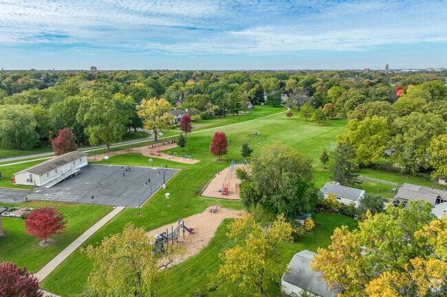 Playground area with fall surrounding leaves at Littlejohn Elementary School in Dekalb.