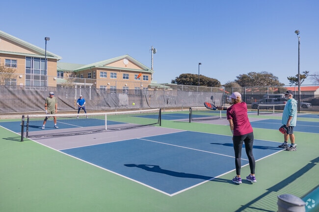 Meet friends on the courts for a fun game of pickleball at Middleton Park in Oak Island.