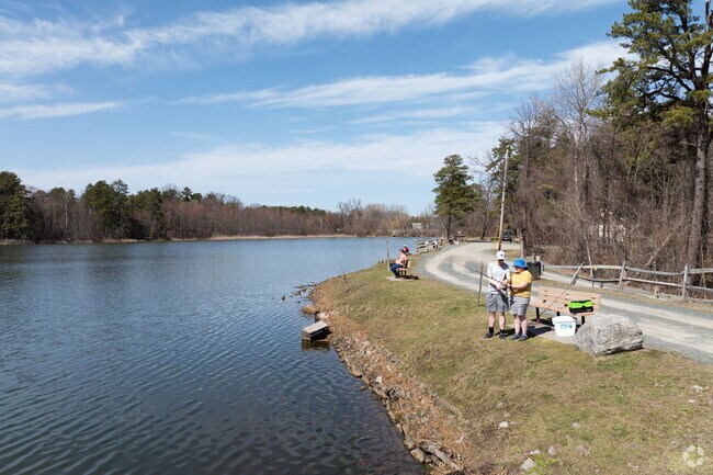 People enjoying some fishing in Six Mile Park just outside the Campus Area.