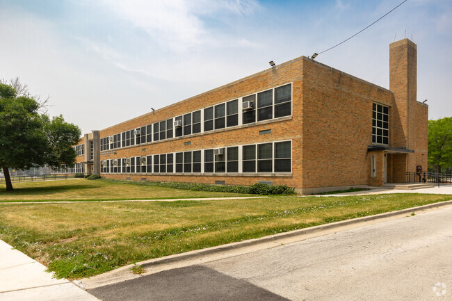 Turner-Drew Language Academy main building with open green space, Chicago, IL.