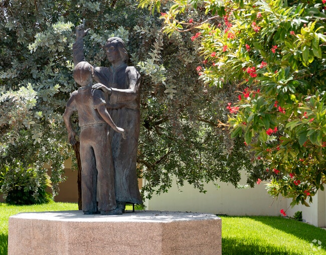 Bless the children's sculpture on the campus of the St John Vianney Catholic School.