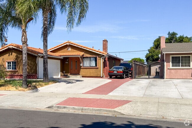 Palm trees flank this Califonia Ranch Home in Yerba Buena of San Jose.