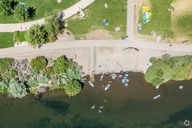 Visitors to Southern Crossing cool off in the Deschutes River.
