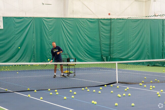 Players compete in a tennis match at the Tuscaloosa Tennis Center near University Area.