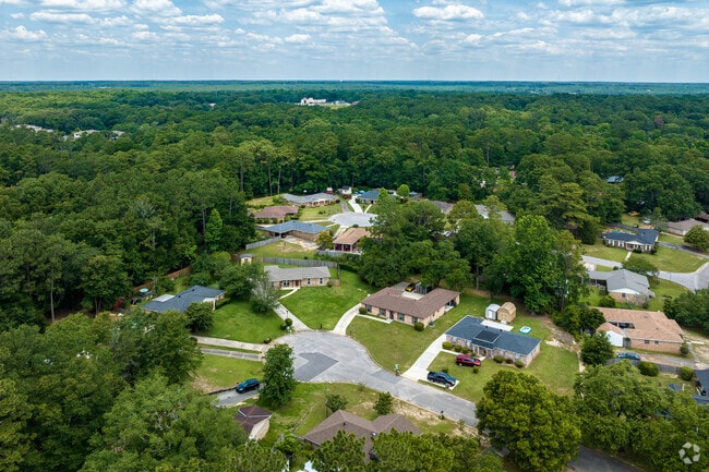 Many homes in the Cody neighborhood are built on medium sized lots with many trees.