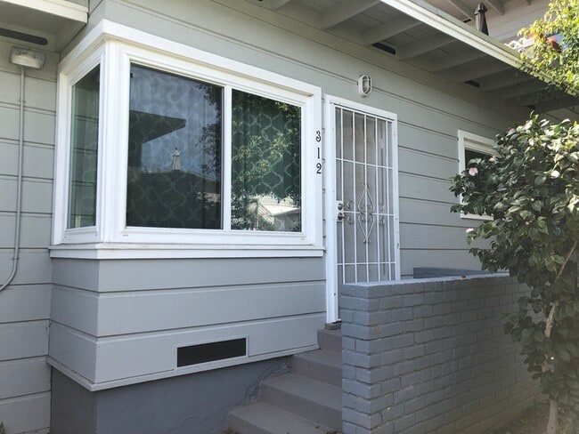 Front entrance and large window.