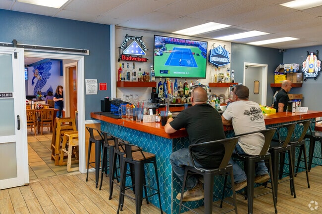 Locals enjoying the match inside El Pata Salada.