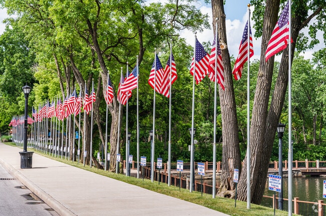 American flags proudly line the pathways of Coe Lake Park in Berea.