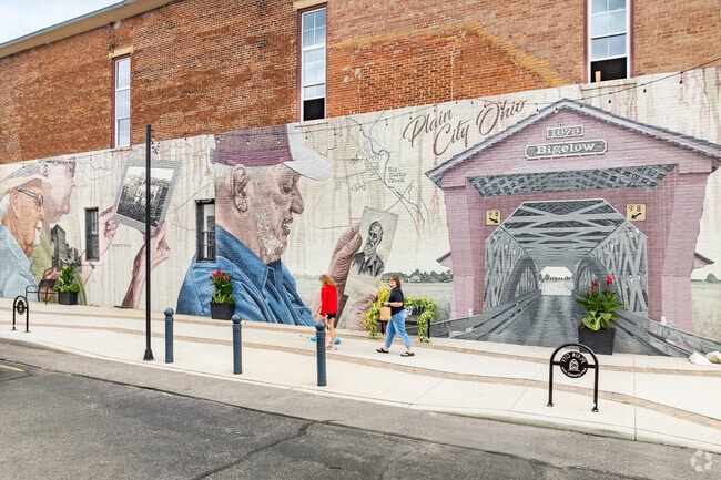 This mural in downtown Plain City depicts the past, present and future of the city.