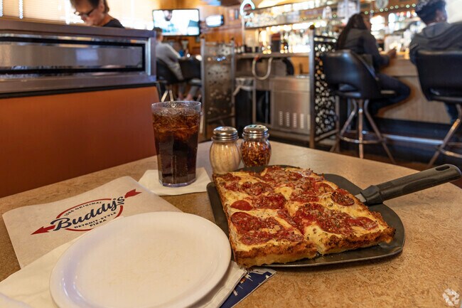 Grab a Detroit style pizza at iconic pizza chain Buddy's near Hawthorne Park.