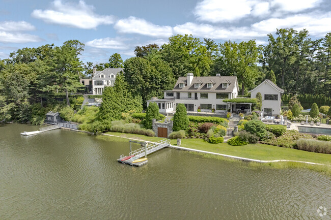 The waterfront homes of Indian Field feature mature trees to separate the properties.