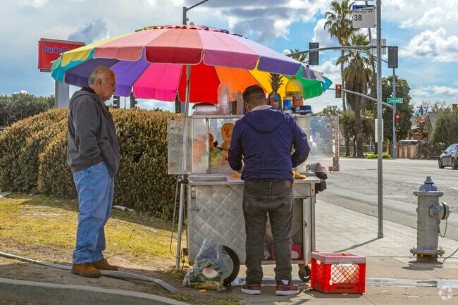 Food vendors offering snacks can be found along the streets of Calwa.