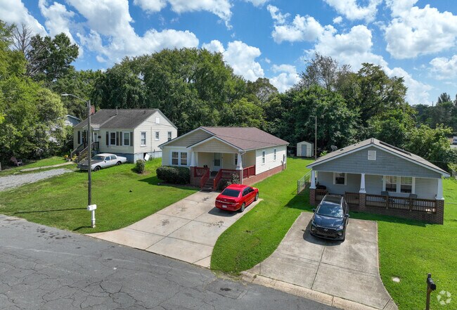 Ranch-style homes line a quiet street in Charlotte’s historic J. T. Williams.