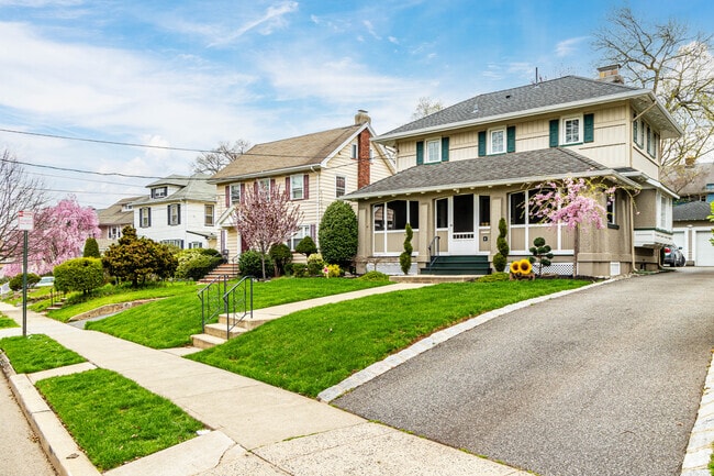 The rows of Colonial revival style home's lawns are nicely manicured in Elmora, NJ.