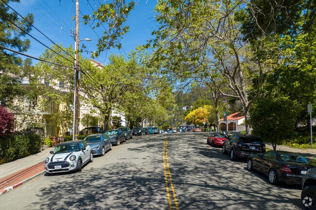 The Claremont neighborhood features leafy streets, sidewalks, and diverse architecture.