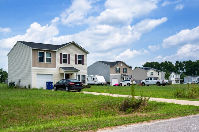 Two-story homes are common near Bell Arthur, many from the 1980s–2010s.