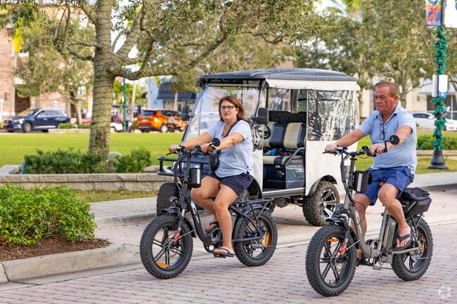 A couple enjoying an evening bike ride through the Riverland/Kennedy neighborhood.