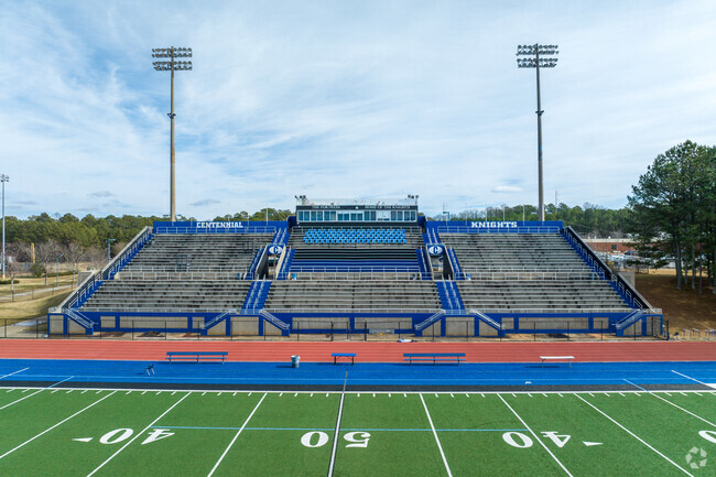 Centennial High School features a football stadium with ample seating.