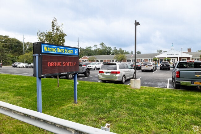 NID 537930 Wading River School is located right off Route 25a near a commercial district.