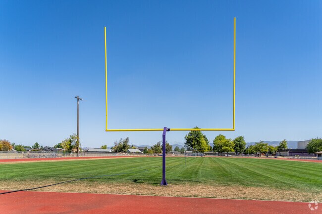 Harrisburg Middle School students play sports on the football field.