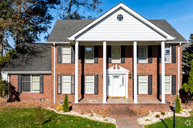 Camellia Shores boasts beautiful Greek revival homes with tall columns and porches.