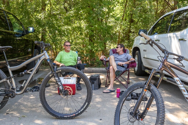 Sit back with a friend and rest after a long bike ride around Rowlett Creek Preserve.