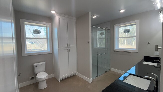 Master bathroom with floor to ceiling linen closet