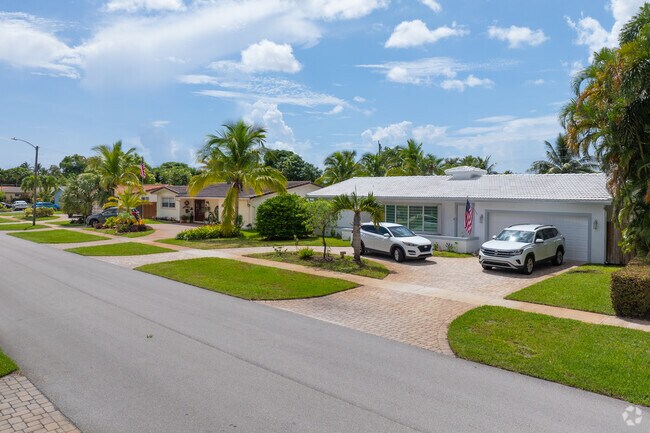 A row of ranch-style homes in Lawn Acres reflects 1950s Americana in suburban South Florida.