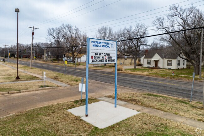 There is a large sign by the street for Pleasant Valley Middle School.